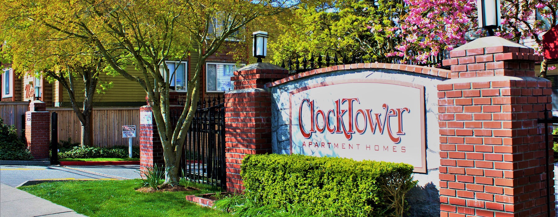 red brick Clocktower sign at property entrance