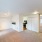 Designer Lighting in spacious living room next to kitchen