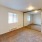 carpeted bedroom with mirrored closed doors